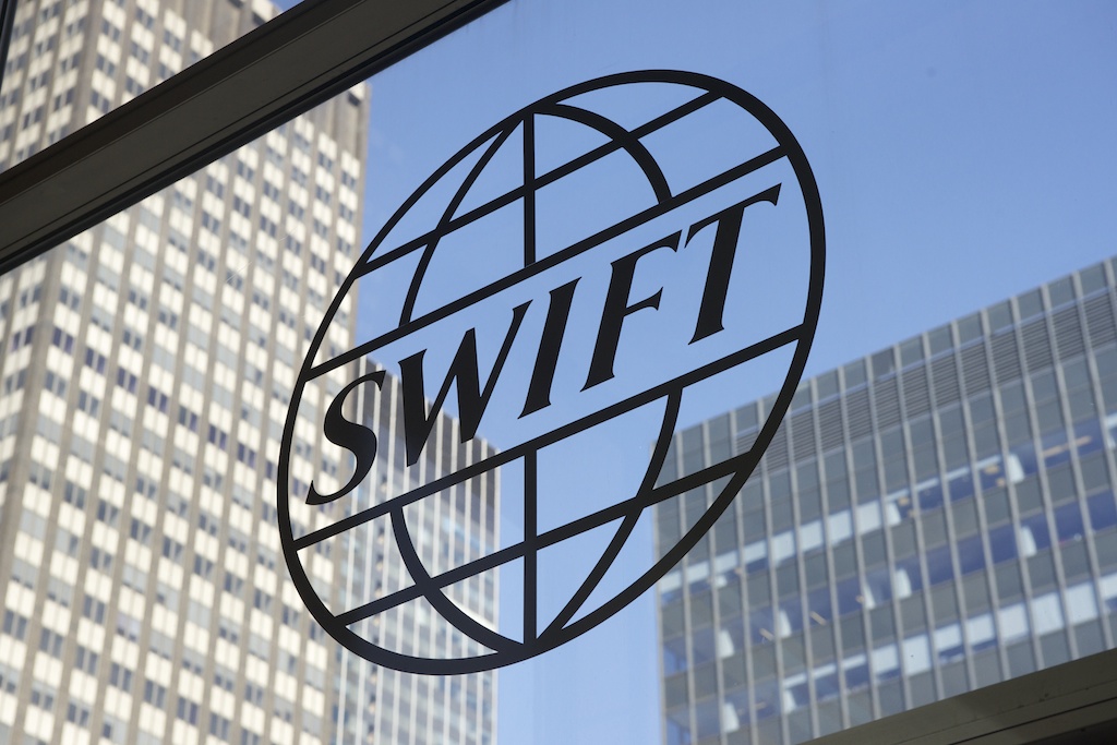SWIFT moves blockchain ledger into pilot stage with 17 banks for tokenized cross-border payments